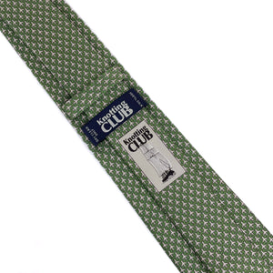 Olive green mulberry silk twill tie with a microprint of airplanes in a shade of grey shown from the back side where the Knotting Club logo and tag are visible