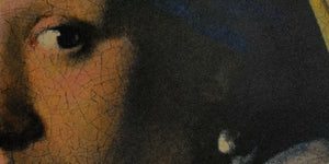Close up image of a silk pocket square of a historical fine-art painting by Johannes Vermeer called the Girl with a Pearl Earring