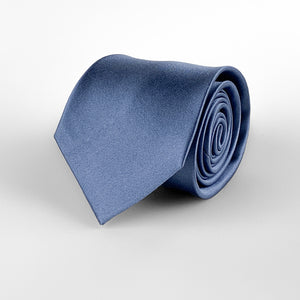 Steel blue mulberry silk satin tie rolled and placed on a white background