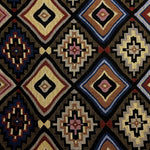 Fabric of a multicolored bohemian pattern cushion.