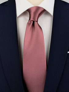 Dark mauve pink mulberry silk satin tie worn with a white shirt and a navy blue suit