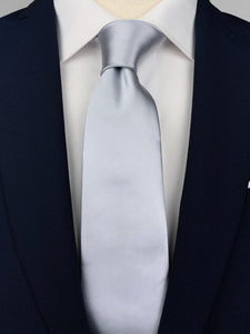 Steel grey mulberry silk satin tie worn with a white shirt and a navy blue suit