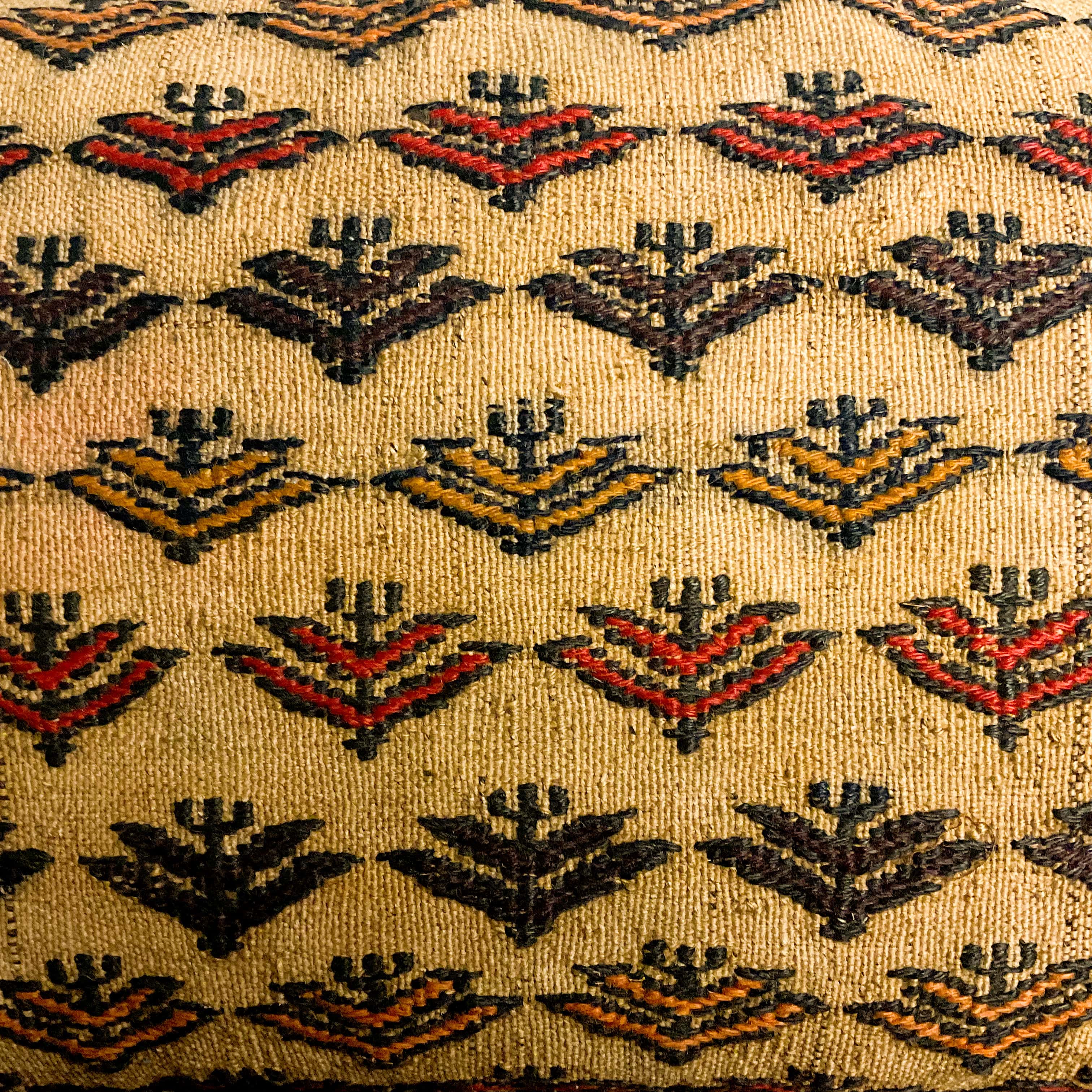 Multicolored geometric pattern of a vintage kilim rug cushion