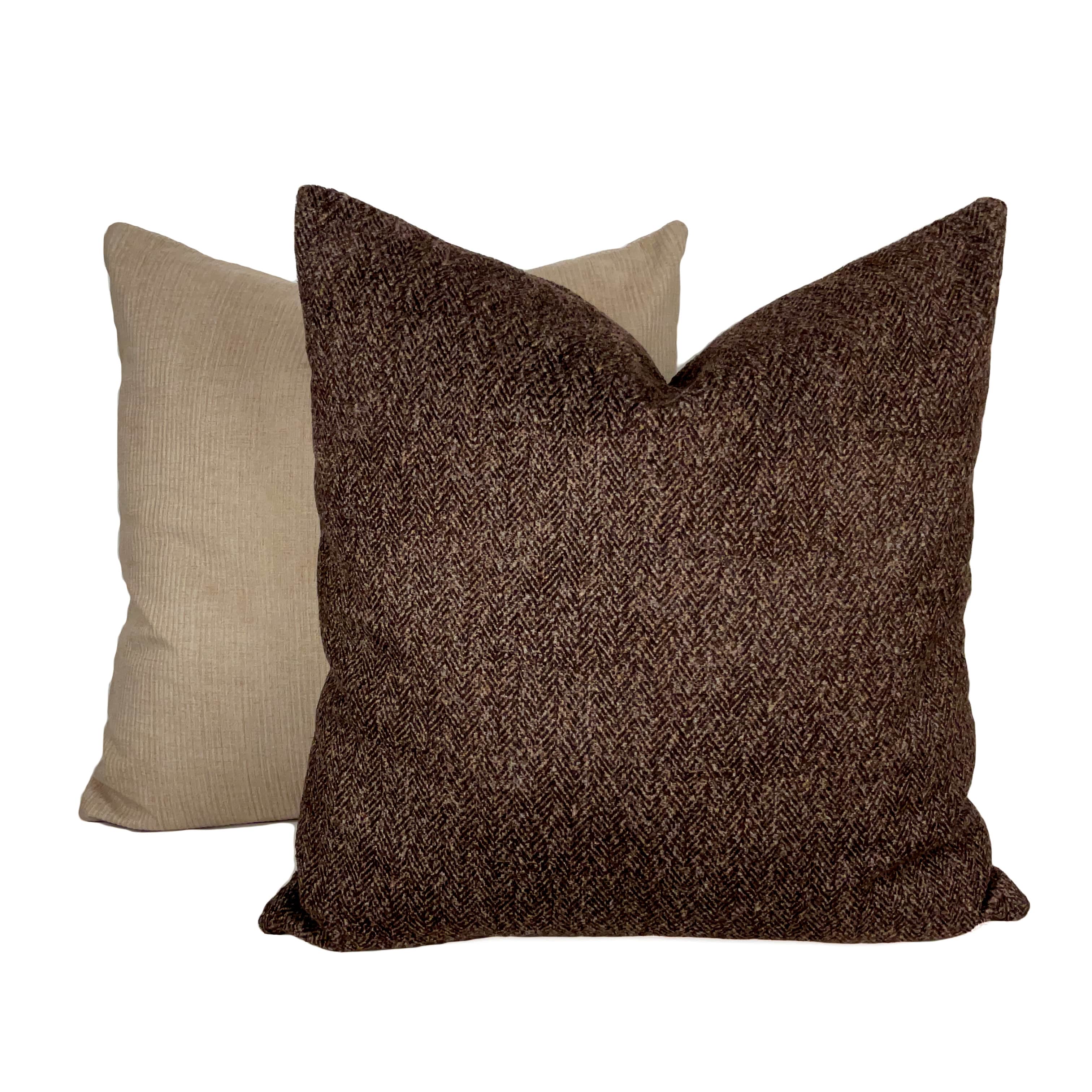 Plain Brown suede cushion placed against a white background