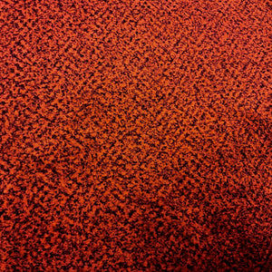 fabric of a rust red cushion