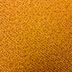 A closeup image of a yellow mustard plain suede cushion showing the inherent pattern