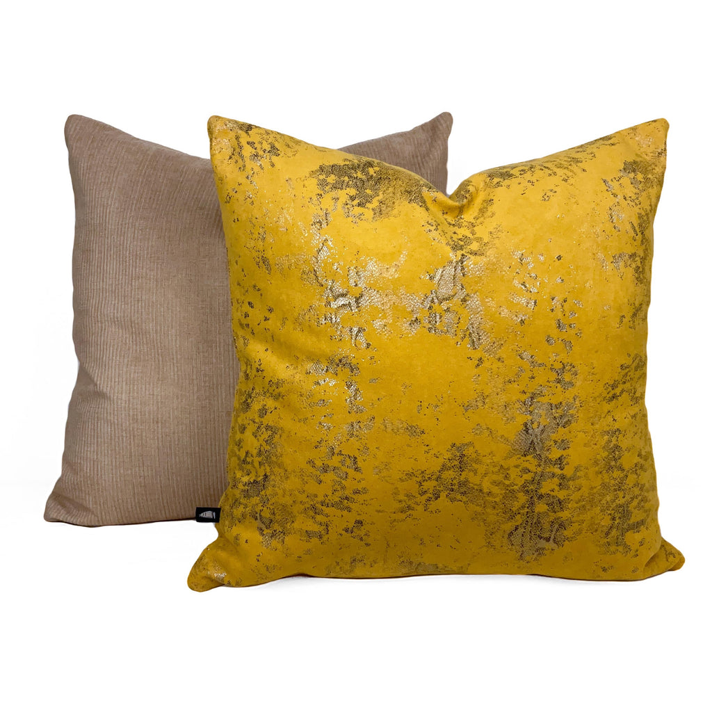 Mustard suede snake skin pattern cushion placed against a white background.