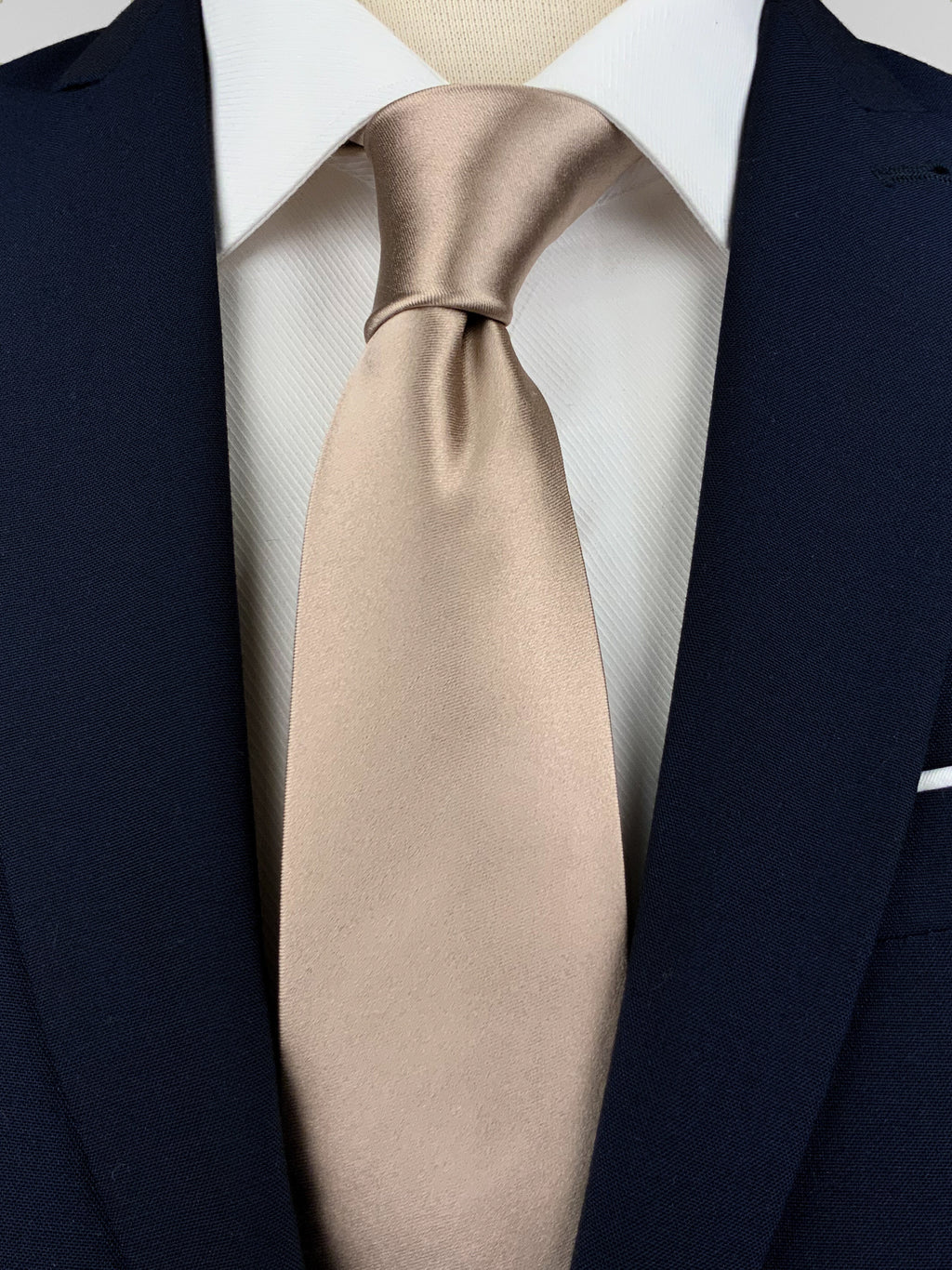 Light gold mulberry silk satin tie worn with a white shirt and a navy blue suit