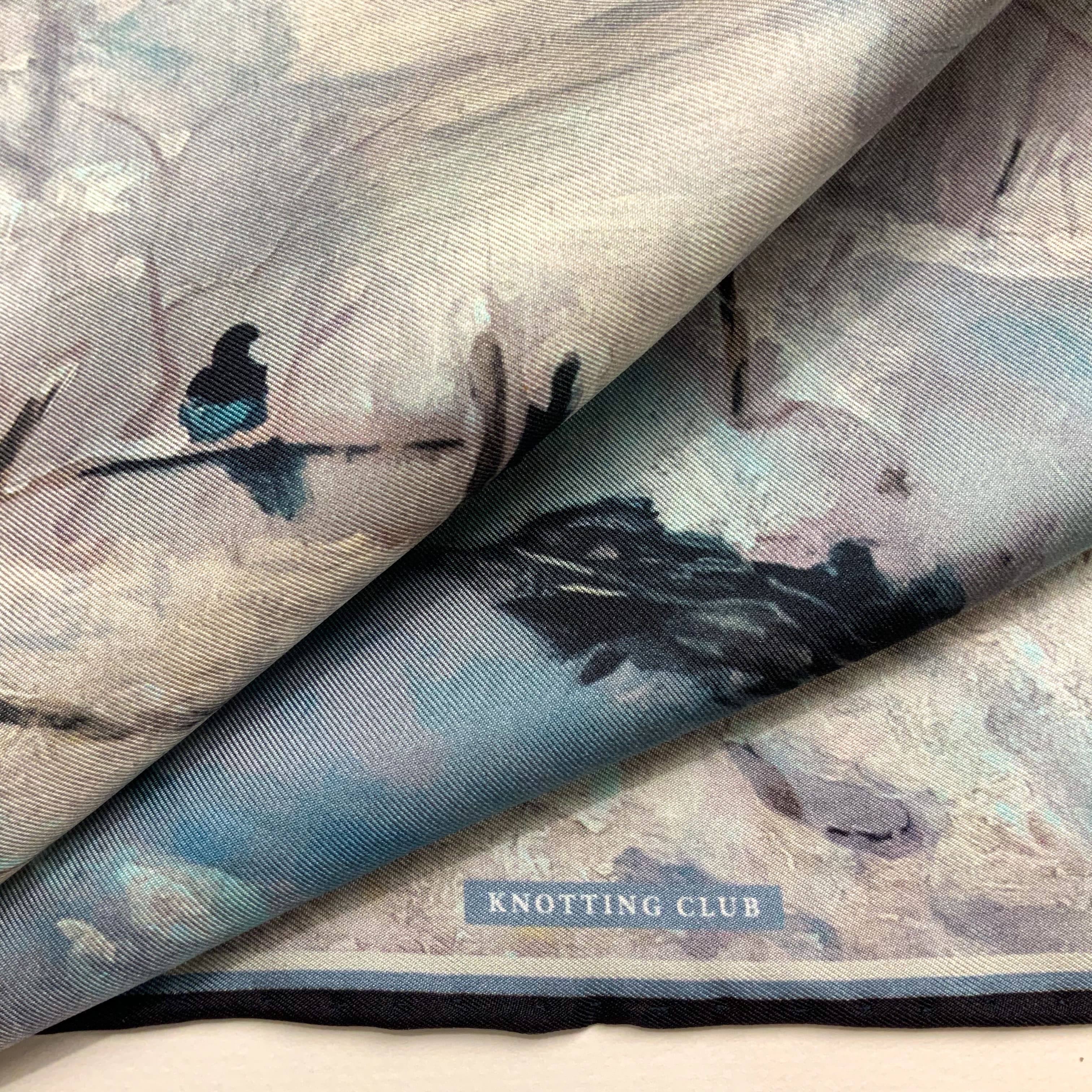 Close up of the details of The Magpie historical fine art silk pocket square